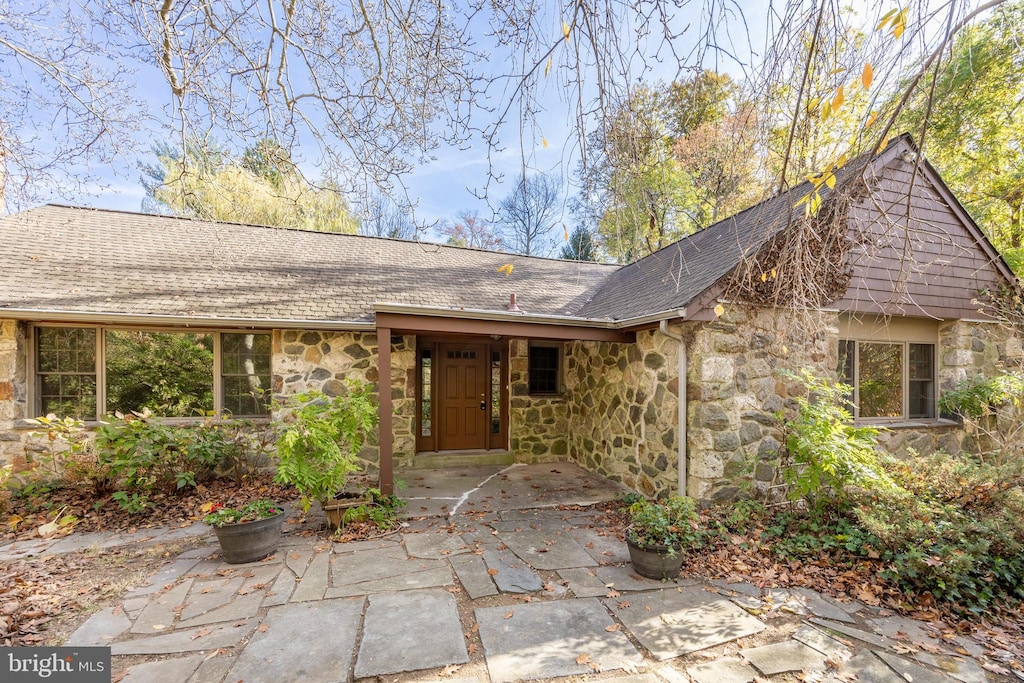 ranch-style home with a patio area