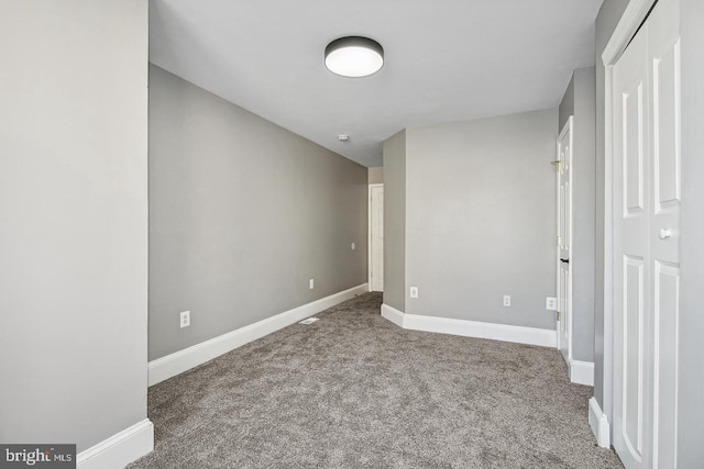 spare room with carpet floors