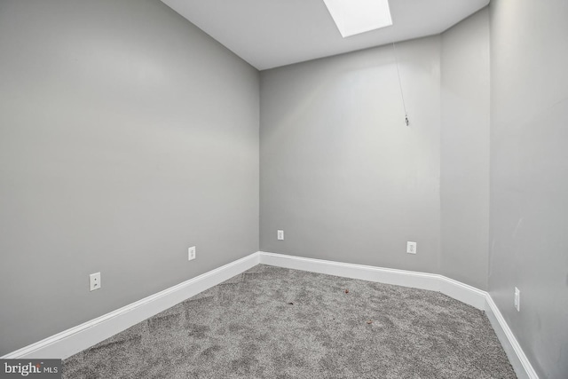 1806 E Lafayette Ave, Baltimore, MD 21213 - carpeted spare room featuring a skylight and baseboards