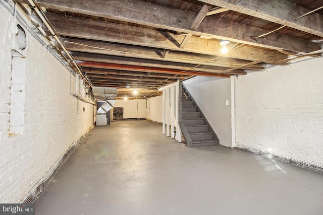 1806 E Lafayette Ave, Baltimore, MD 21213 - unfinished basement featuring stairway and brick wall