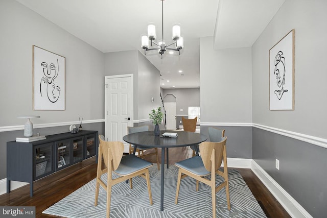1806 E Lafayette Ave, Baltimore, MD 21213 - dining room with wood finished floors, a chandelier, and baseboards