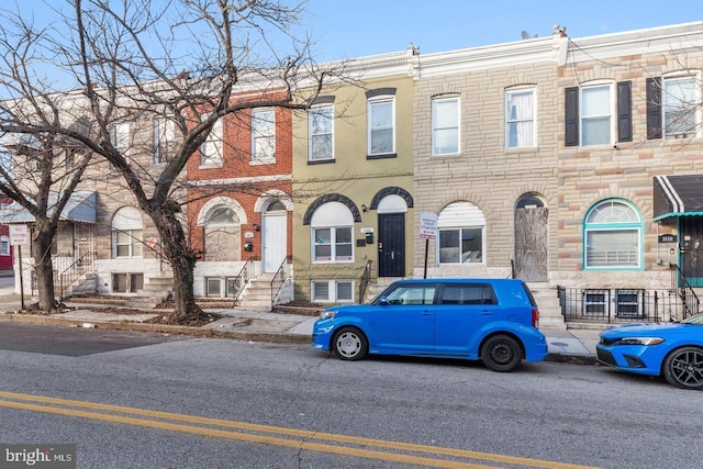 1806 E Lafayette Ave, Baltimore, MD 21213 - townhome / multi-family property with stone siding and entry steps