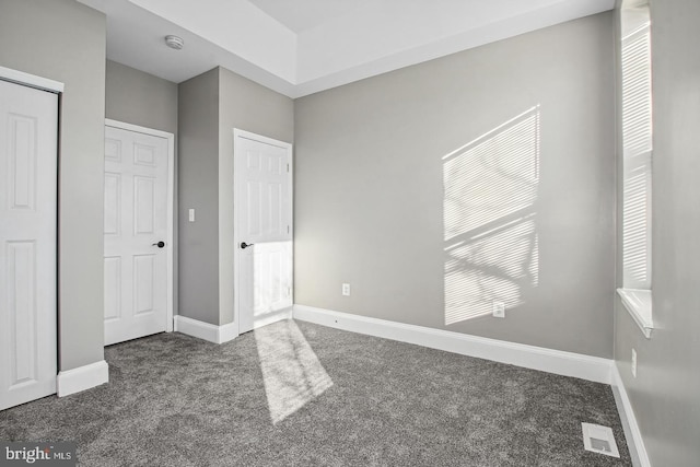 1806 E Lafayette Ave, Baltimore, MD 21213 - unfurnished bedroom with carpet floors, baseboards, and a closet
