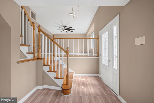 entryway featuring ceiling fan, a healthy amount of sunlight, and light hardwood / wood-style floors