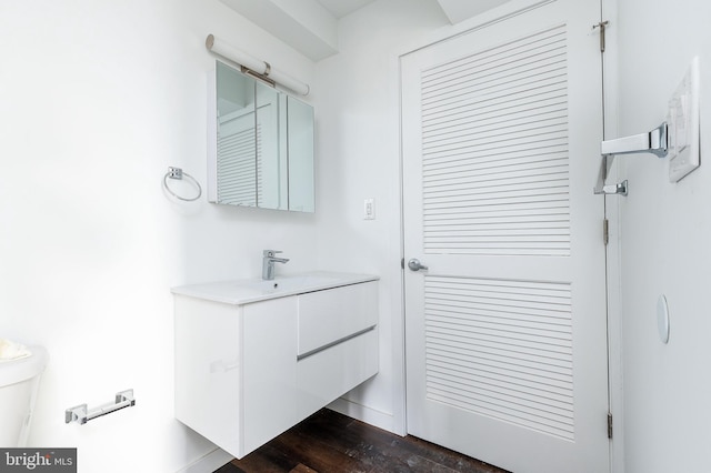 bathroom with wood-type flooring and vanity