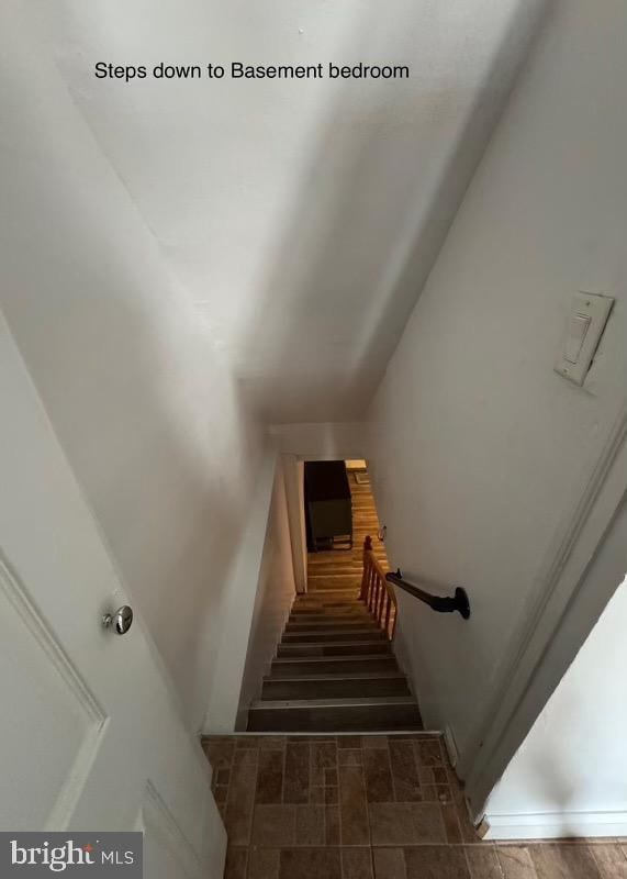 staircase with lofted ceiling