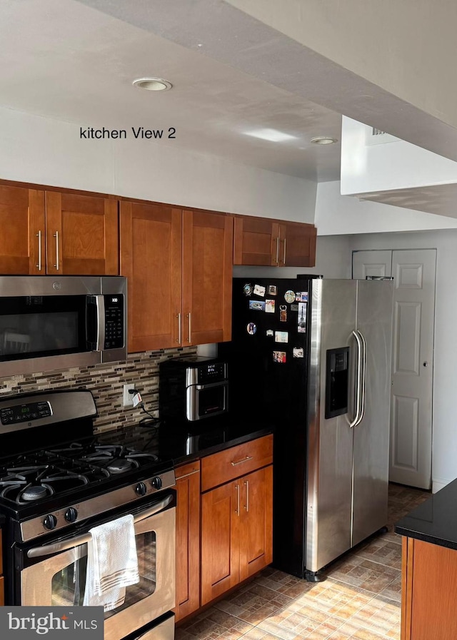 kitchen with backsplash and stainless steel appliances