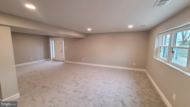 empty room with light colored carpet