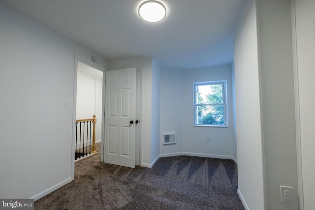 carpeted spare room with crown molding