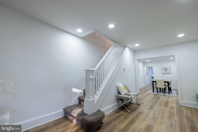 staircase featuring hardwood / wood-style flooring