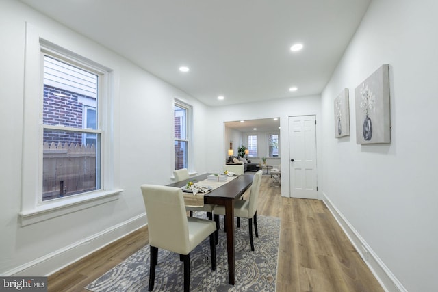 dining area with hardwood / wood-style flooring