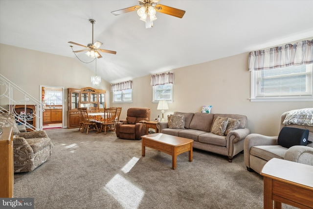 carpeted living room featuring high vaulted ceiling, ceiling fan, sink, and a wealth of natural light