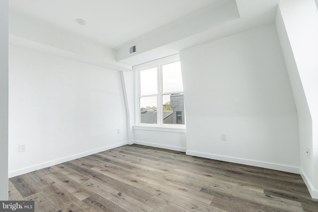 empty room with hardwood / wood-style floors