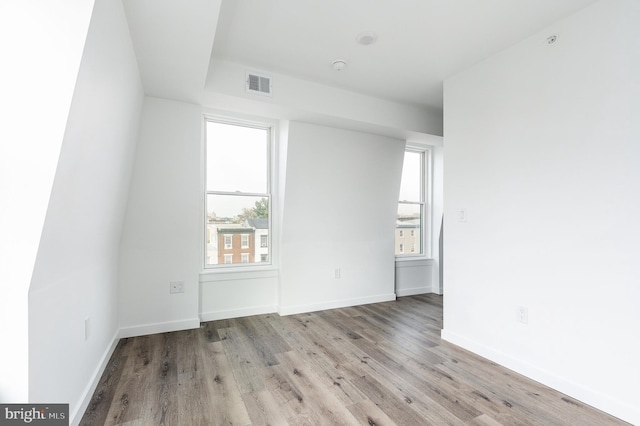 unfurnished room featuring light hardwood / wood-style floors