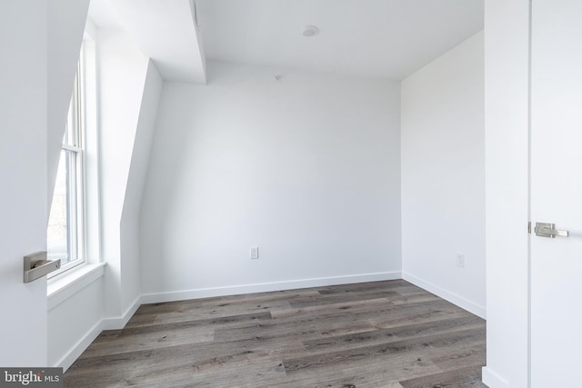 unfurnished room with hardwood / wood-style floors