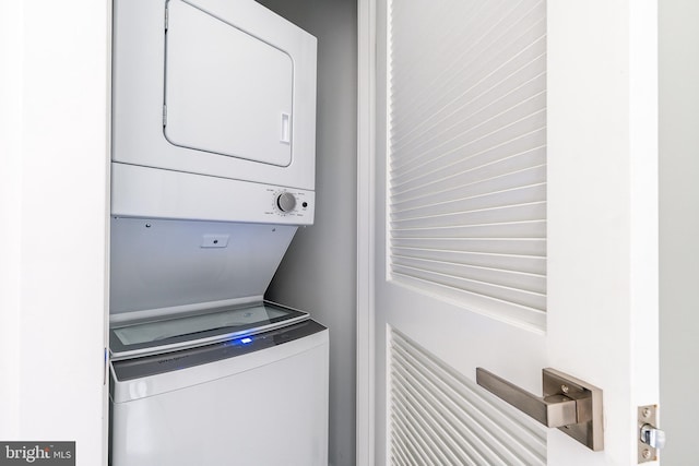 laundry area featuring stacked washer and dryer