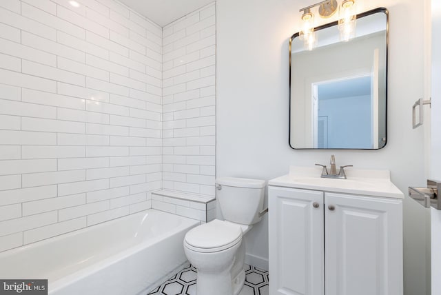 full bathroom featuring vanity, toilet, and tiled shower / bath