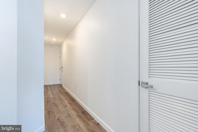 hall with light wood-type flooring