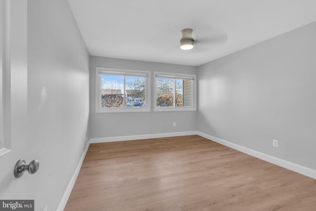 unfurnished room with light hardwood / wood-style flooring and ceiling fan