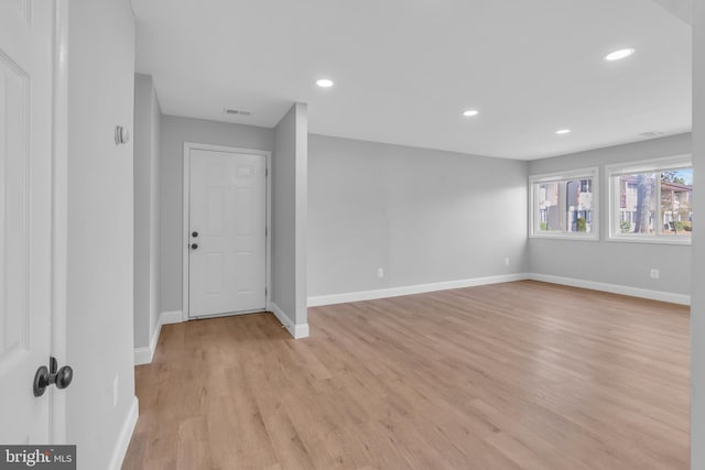 unfurnished room featuring light hardwood / wood-style flooring