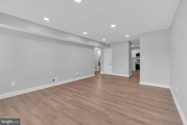 9 Avon Dr Unit A, Hightstown, NJ 08520 - unfurnished living room with recessed lighting, baseboards, and light wood finished floors