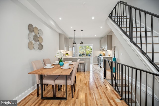 dining room with light hardwood / wood-style floors