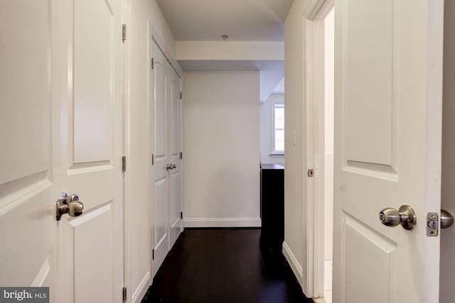 hallway featuring dark hardwood / wood-style floors