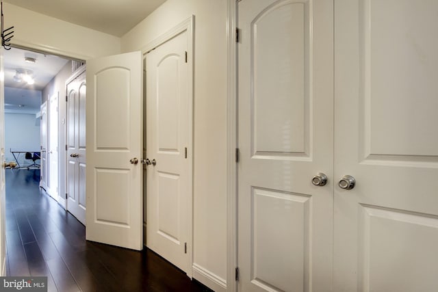 hall with dark hardwood / wood-style floors