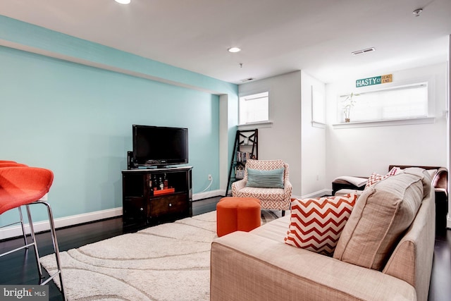 living room featuring dark wood-type flooring