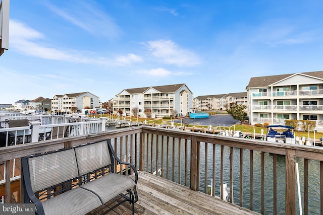 wooden deck with a water view