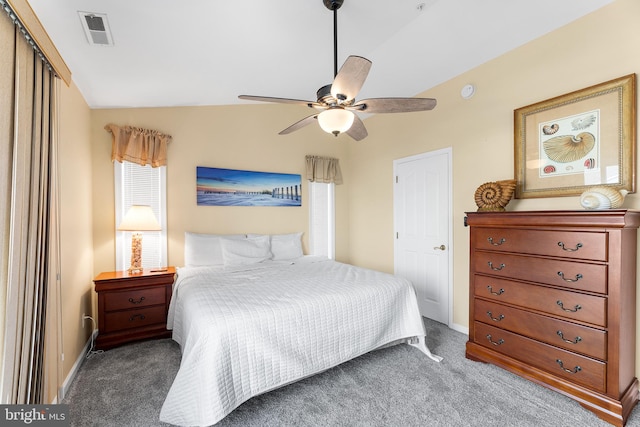 bedroom featuring ceiling fan, a closet, carpet floors, and lofted ceiling