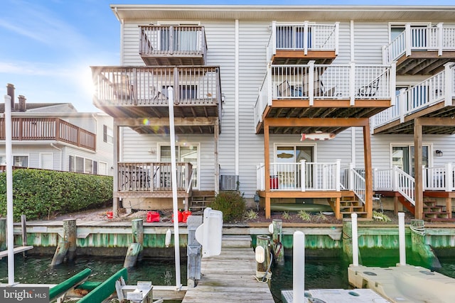 back of property with a water view