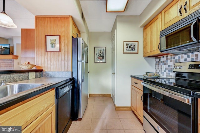 kitchen with black appliances, decorative backsplash, light tile patterned floors, light brown cabinetry, and decorative light fixtures