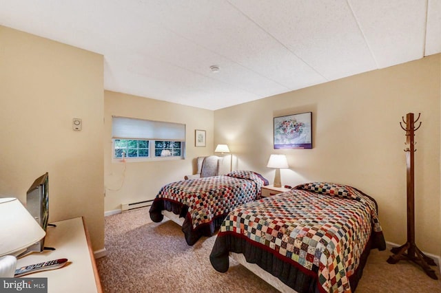 bedroom with carpet and a baseboard radiator