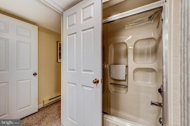 bathroom featuring baseboard heating and enclosed tub / shower combo