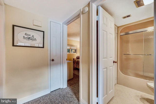 hallway with carpet flooring