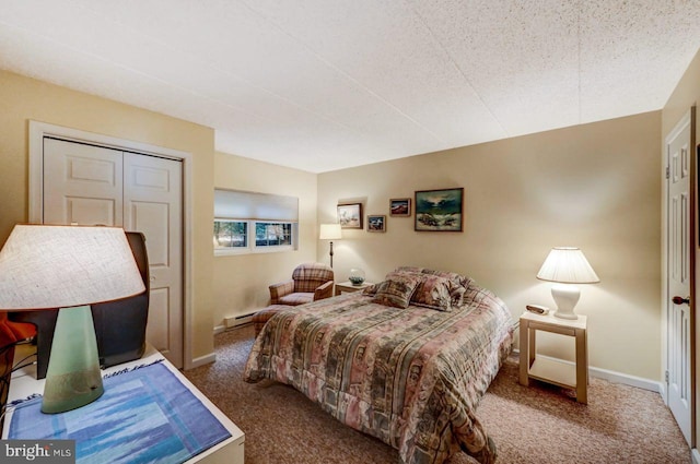 bedroom with carpet flooring, a textured ceiling, and a closet