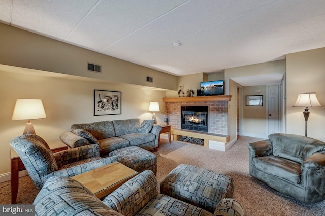 living room featuring carpet flooring and a fireplace