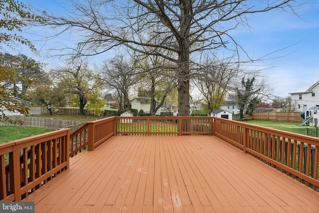 wooden deck with a lawn