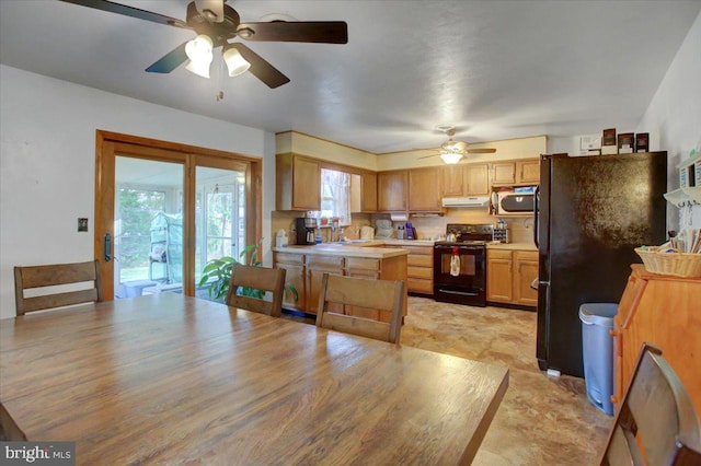 kitchen with black appliances, ceiling fan, and light hardwood / wood-style floors