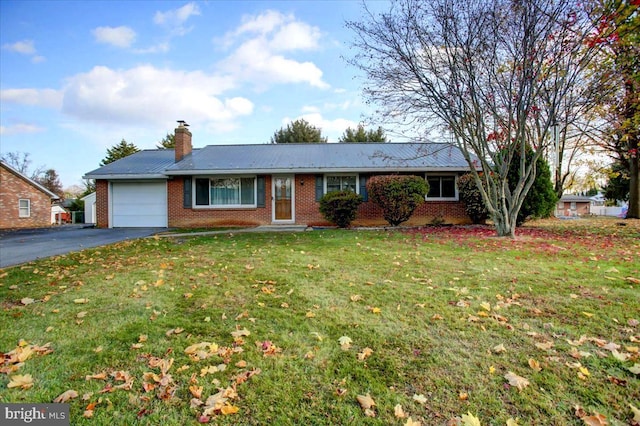 single story home with a garage and a front yard