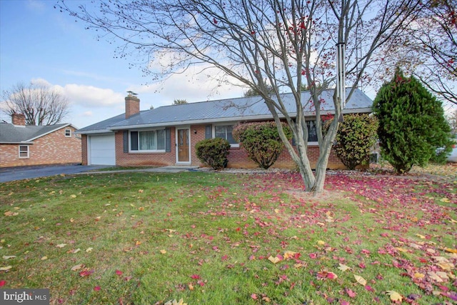 ranch-style home with a garage and a front yard