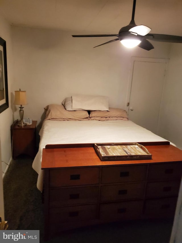 carpeted bedroom with ceiling fan