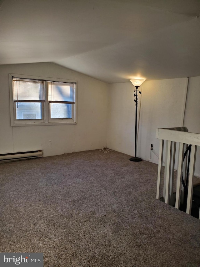 interior space with a baseboard radiator and lofted ceiling