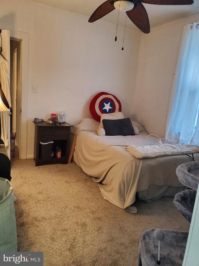 carpeted bedroom featuring ceiling fan