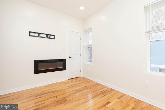 unfurnished room featuring light hardwood / wood-style flooring