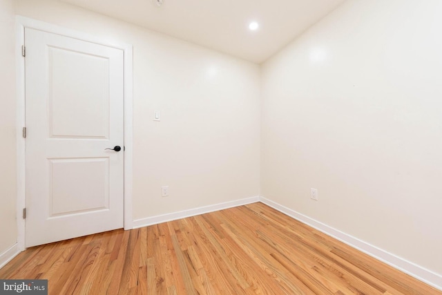 spare room featuring light wood-type flooring