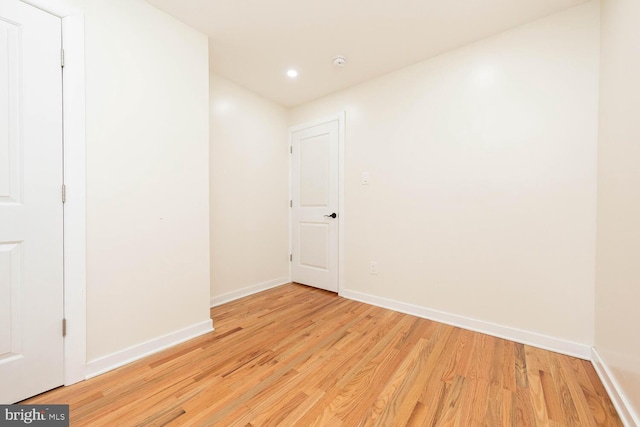 spare room with light hardwood / wood-style flooring