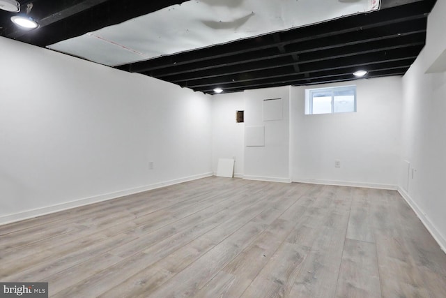 basement featuring light hardwood / wood-style floors