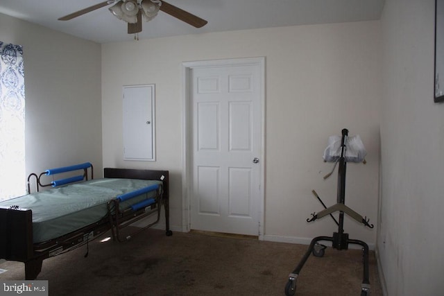 bedroom with ceiling fan and dark carpet